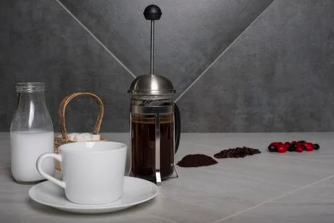 Low angle view of coffee berries, beans, and grounds shown on counter with br Stock Photos