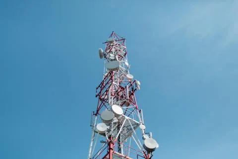 Low Angle View Of Communications Tower Against Blue Sky Stock Photos