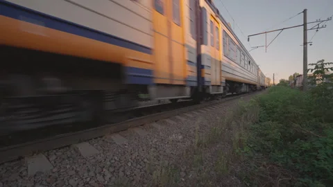 Low Angle View of Commuter Train Wheels Passing on Railway Track Stock Footage 344899940