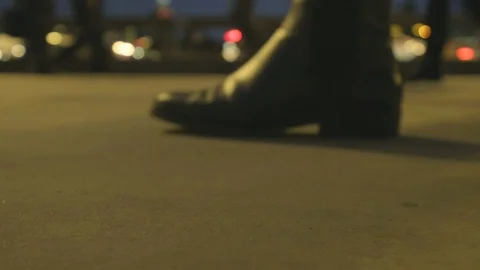 Low angle view of commuters feet at rush hour at dusk on london bridge Stock Footage 96362674