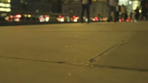 Low angle view of commuters feet at rush hour at dusk on london bridge Stock Footage 96365467