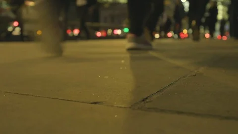 Low angle view of commuters feet at rush hour at dusk on london bridge Stock Footage 96367179