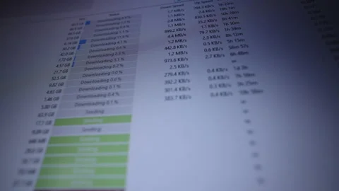 Low-angle view of computer screen showing p2p client interface with close-up of Stock Footage 318469294