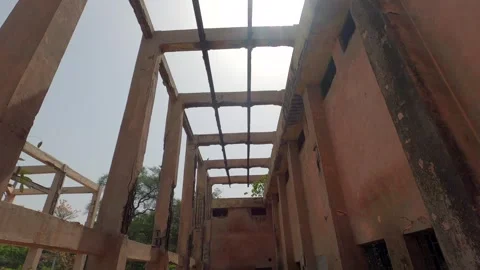 Low Angle View of Concrete Beams in Roofless Abandoned Building Structure 動画素材 332580078