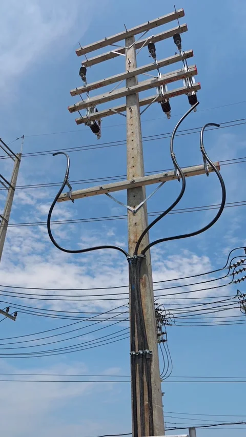 Low angle view of concrete riser pole with high voltage underground cables. Stock-Footage 338194749