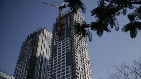 Low angle view of construction crane working on the high building in Tel Aviv. A Stock Footage 181649767
