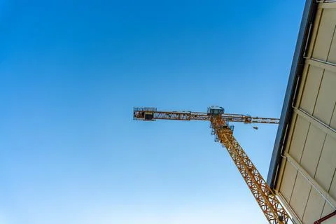 Low Angle View of Construction Tower Crane Against Blue Sky Stock Photos
