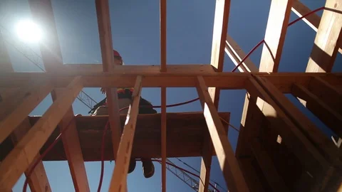 Low Angle View of Construction Worker Using Hammer to Frame a Structure Stock Footage 118939709