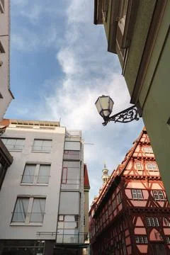 Low angle view contrasting modern and traditional half-timbered architectur.. Stock Photos