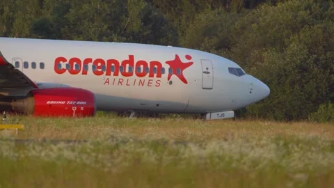 Low angle view of Corendon Airlines passenger airplane taxiing on the taxiway Stock Footage 252148024