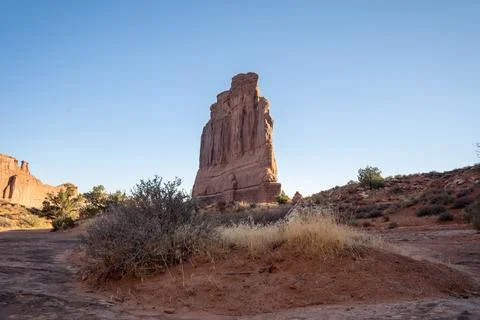 A low-angle view of the Courthouse Towers red rocks in Arches National Park. Stock Photos