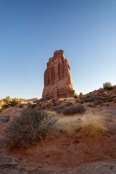 A low-angle view of the Courthouse Towers red rocks in Arches National Park. Stock Photos