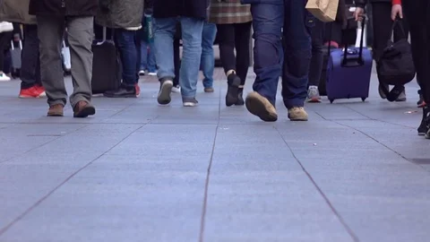 Low angle view of a crowd people walking... | Stock Video | Pond5