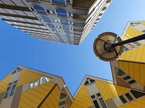 Low angle view of the Cube houses (Kubuswoningen) and Blaaktoren (Het Potlood Stock Photos