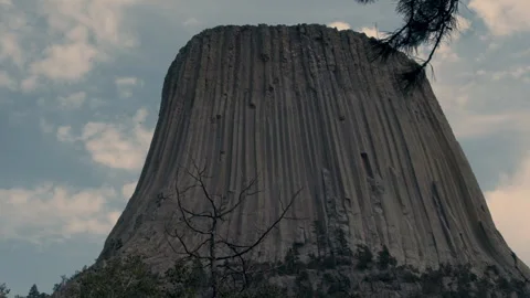 Low Angle View of Devils Tower Beneath Cloudy Sky Stock Footage 340245029