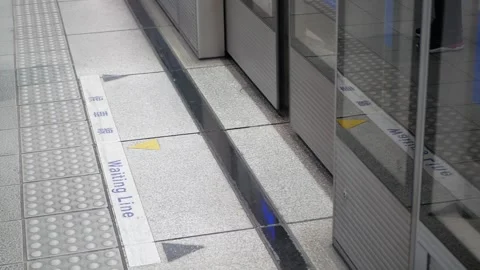Low angle view to the door gate of the subway's door train commuter on plat.. Stock Footage 247868077