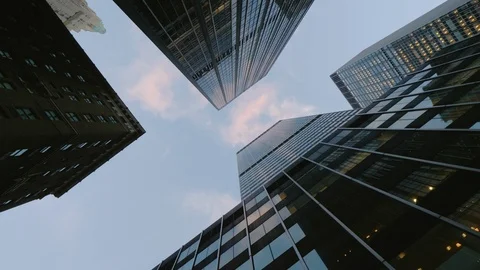 Low angle view: Drive through Manhattan, skyscrapers hang over your head. Stock Footage 98279786