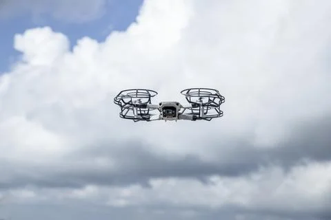 Low Angle View Of Drone Against Cloudy Sky Stock Photos