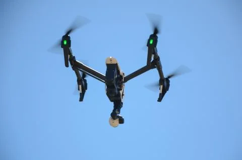 Low Angle View Of Drone Flying Against Sky Stock Photos