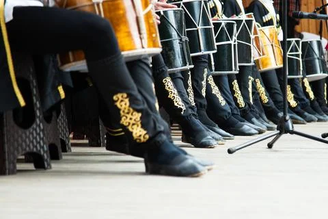 Low angle view of drummers playing on national ossetian drums . Stock Photos