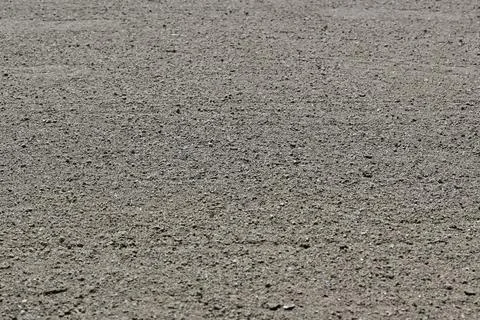 Low angle view of dry dirt ground on an empty sports field Stock Photos