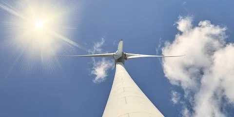 Low angle view of a Dutch wind turbine with blue sky and sunlight Stock Photos