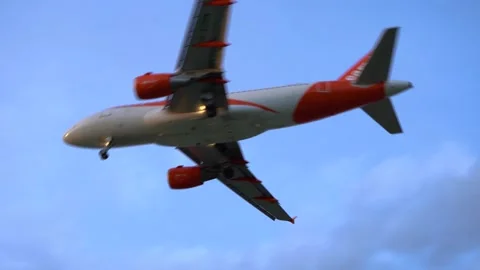 Low angle view of EasyJet (Easy Jet) passenger airplane landing Stockbeeldmateriaal 220602588