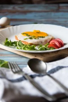 Low angle view of egg and bread with condiments on a plate Stock Photos