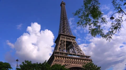 Low angle view of the Eiffel Tower in Paris with cloudy sky. Video stock 41581493