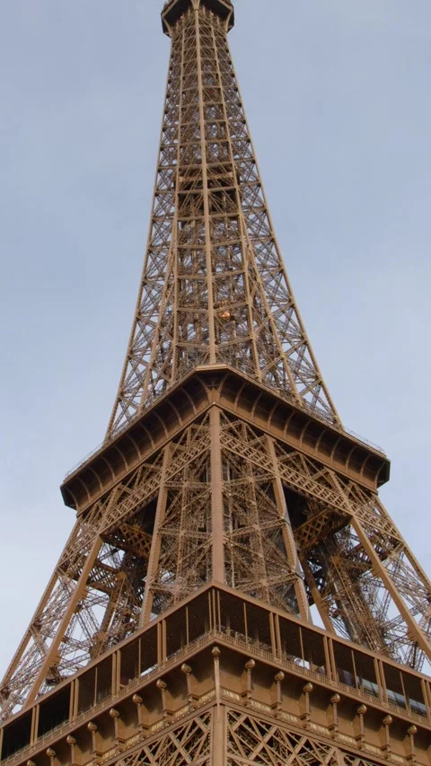 Low Angle View of the Eiffel Tower Against a Cloudy Sky Stock Footage 334987469