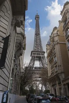 Low angle view of Eiffel Tower against cloudy sky, Paris, France Stock Photos