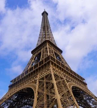 Low Angle View of the Eiffel Tower with Blue Sky Stock Photos
