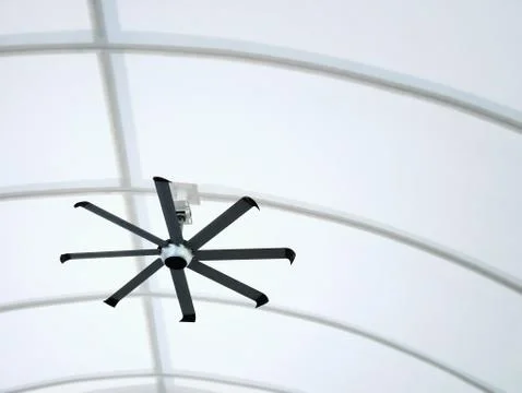 Low Angle View of Electric Ceiling Fan Hanging Under Curved Roof Structure Stock Photos