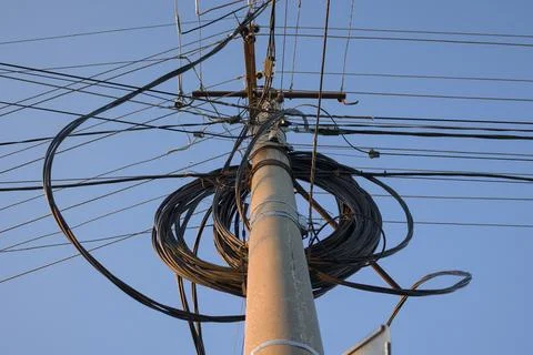 Low angle view of electric pole with wires . Stock Photos