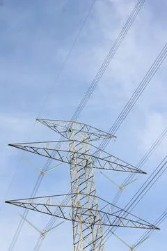 Low angle view of electric pole with natural sky background Stock Photos