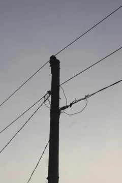 Low angle view of electric pole with natural sky background Stock Photos