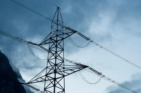 Low Angle view on Electric Powerline Tower, geometric grid structure agains.. Fotos Stock