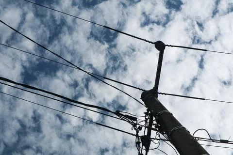 Low angle view of electrical pole Stock Photos
