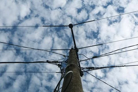 Low angle view of electrical pole Stock Photos