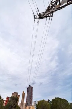Low Angle View of Electrical Pylon and Benidorm Skyscrapers Stock Photos