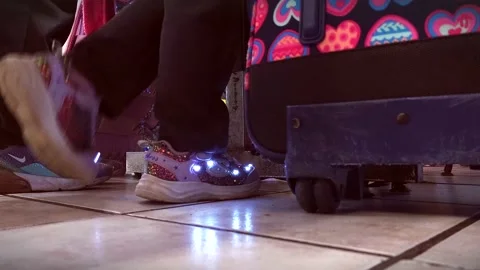 Low Angle View of Elementary School Girl Showing Light Up Shoes Stock Footage 221860147