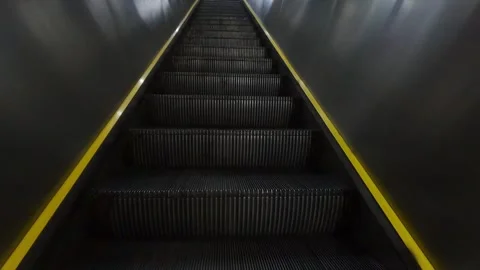 Low-angle view of an empty black escalator Stock Footage 328485945