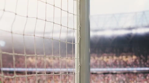 Low angle view of empty goal net and side post on football pitch Stock Footage 338000733