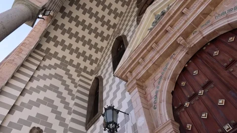 Low angle view of the entrance and geometric facade of Mazatlan Cathedral in Stock Footage 337797802
