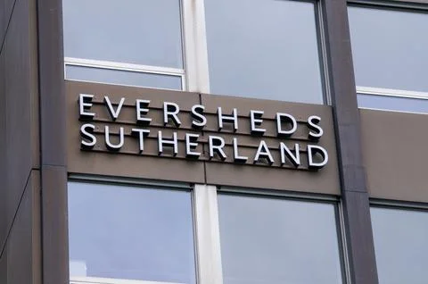 Low angle view of the Eversheds Sutherland law firm sign on a modern buildi.. Stock Photos