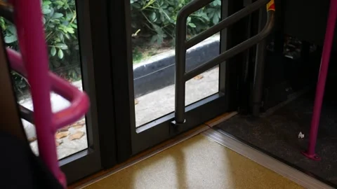 Low angle view to the exit door gate of the bus while bus moving in singapo.. Stock Footage 243994895