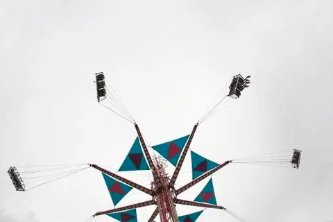 Low angle view of a fairground swing ride Stock Photos