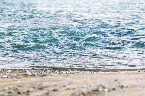 Low Angle View of Fast River Waves, Wet Coarse Sand, Pebble. Stock Photos