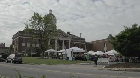 Low Angle View Of Female Walking Into A Local Small Town Farmer's Market. 4K Stock Footage 152647541