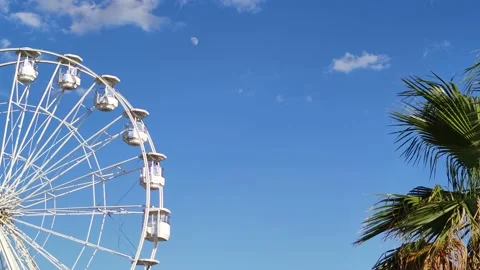 Low Angle View of Ferris Wheel on Blue Sky Background.  Stock Footage 202339901